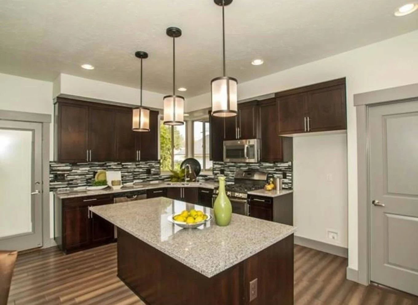 Kitchen cabinet painting with dark wood finish in the Treasure Valley