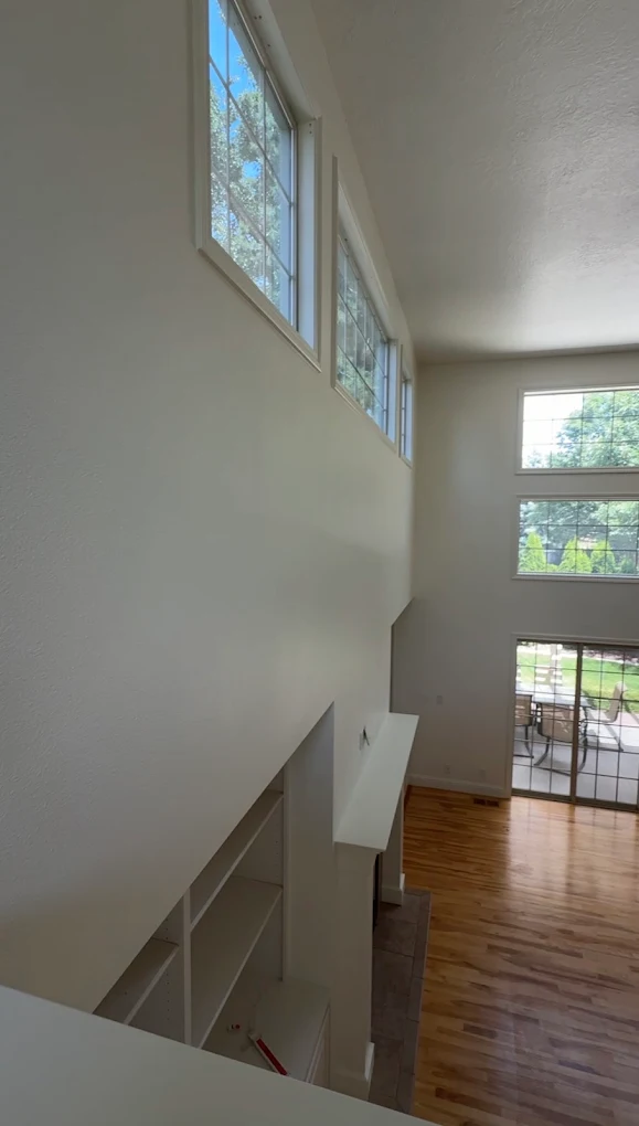 Interior stairwell and high-ceiling painting in a Boise, Idaho home