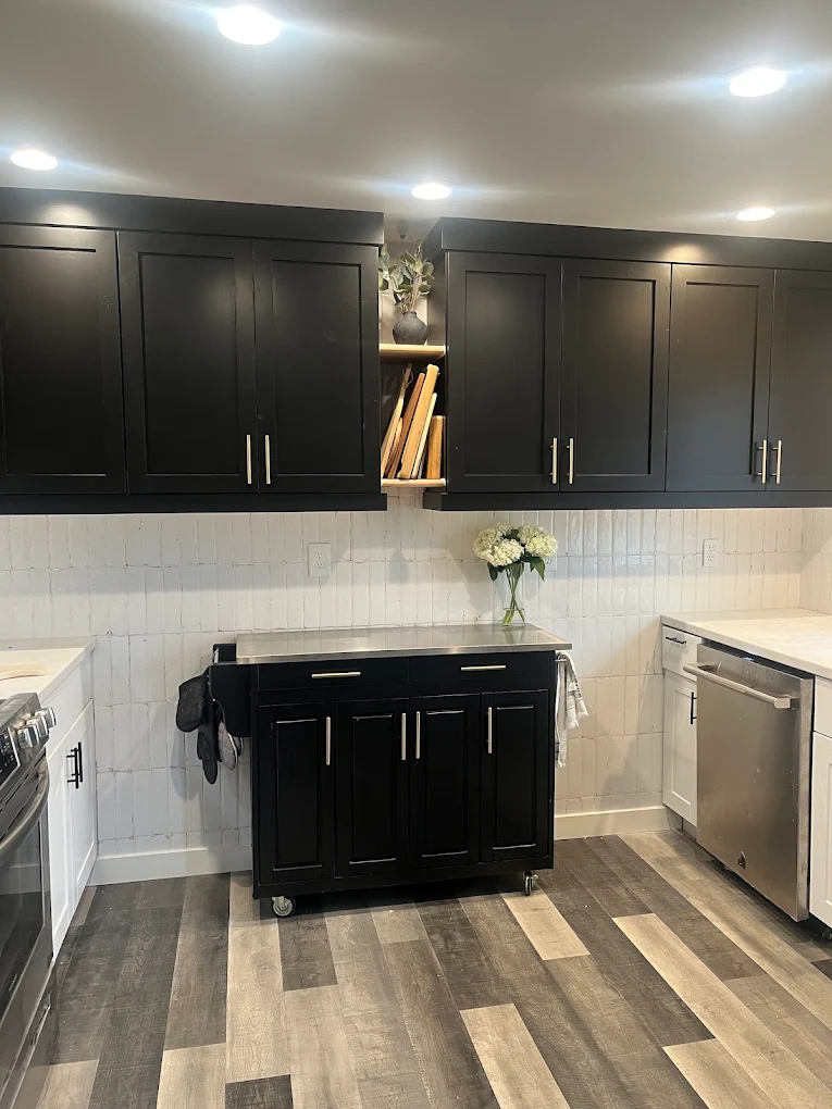 Painted black kitchen cabinets in an Idaho home by Simon's Painting